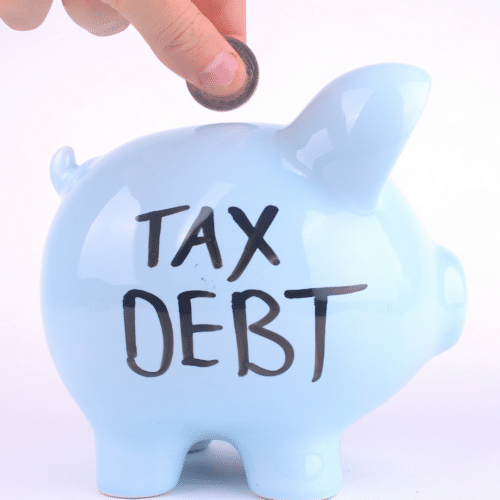 a piggy bank with Tax debt written on it